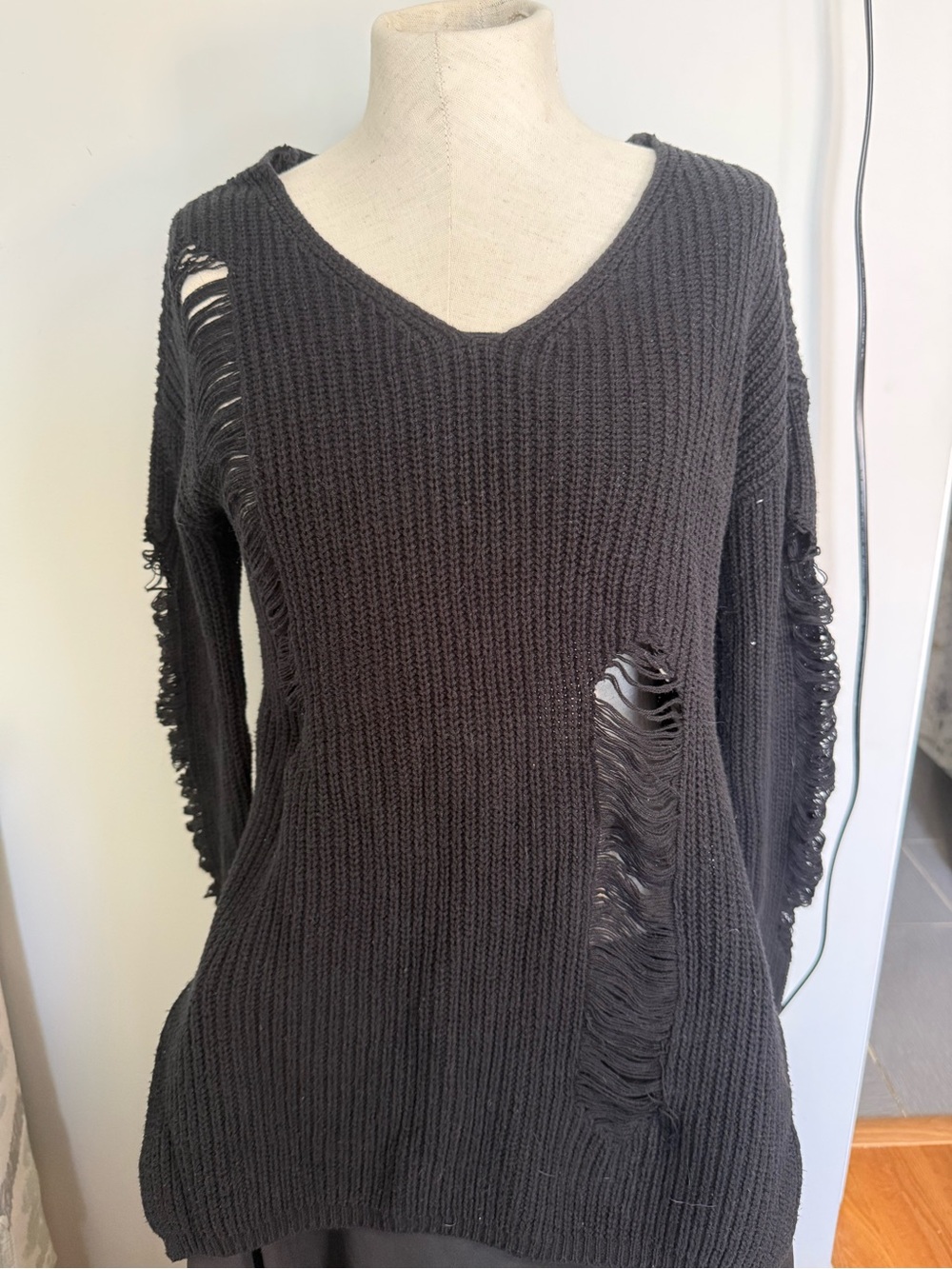 Distressed V-Neck Ribbed Sweater in Black